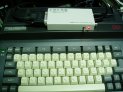 写真上部が今回購入したアダプタ